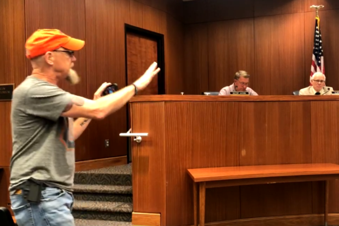 Brian Ogstad, recording with his phone, confronts the Cullman City Council over the City’s COVID-19 response in August 2021. (Cullman Tribune file photo)