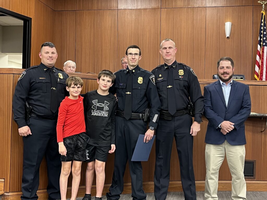 Daniel Hunt was promoted to major. Left to right are Assistant Chief Brandon Patterson, Ethan Hunt, Sawyer Hunt, Major Daniel Hunt, Chief Joey Duncan and Councilman Brad Smith. (W.C. Mann for The Cullman Tribune)