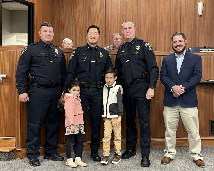 Intae Suh was promoted to major of investigation. Left to right are Assistant Chief Brandon Patterson, Taisley Suh, Major Intae Suh, Torrin Suh, Chief Joey Duncan and Councilman Brad Smith. (W.C. Mann for The Cullman Tribune)